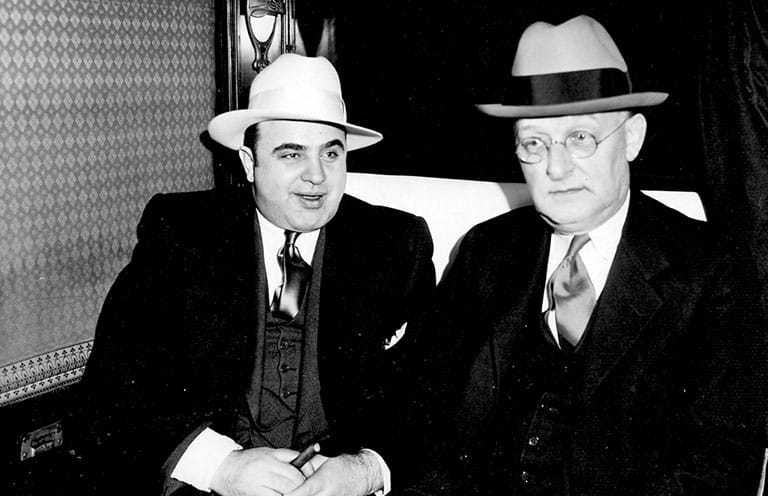 Capone sitting with Fedora